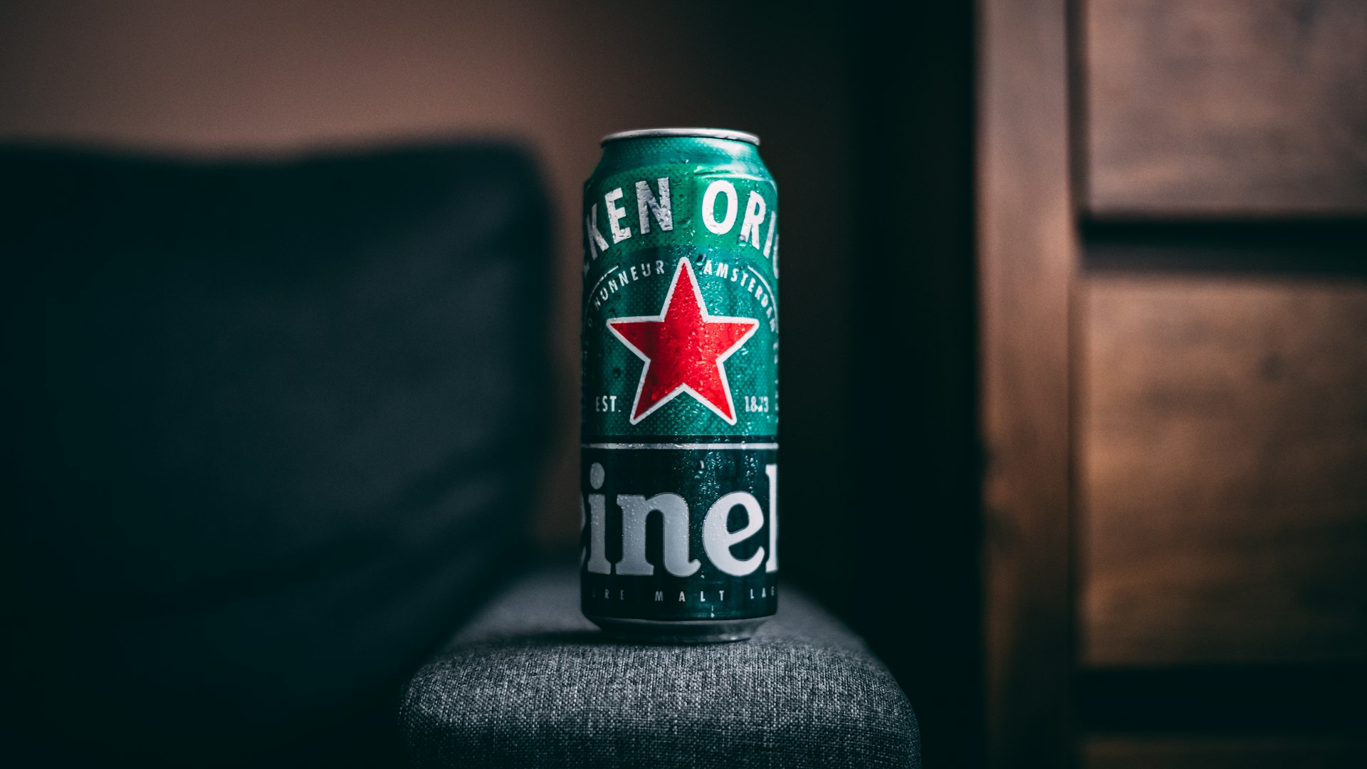blue and green can on black textile
